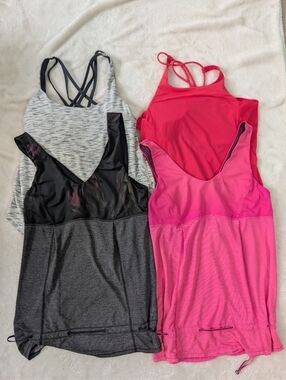 Four Lululemon Athletic Tanks
